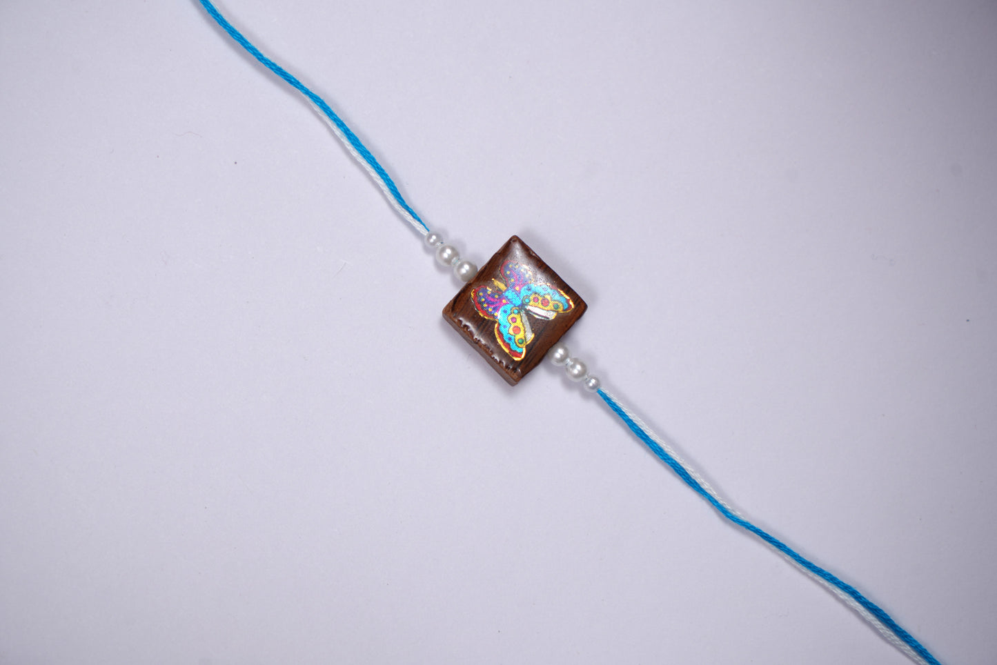 Multicolour Blue Wooden Butterfly Rakhi