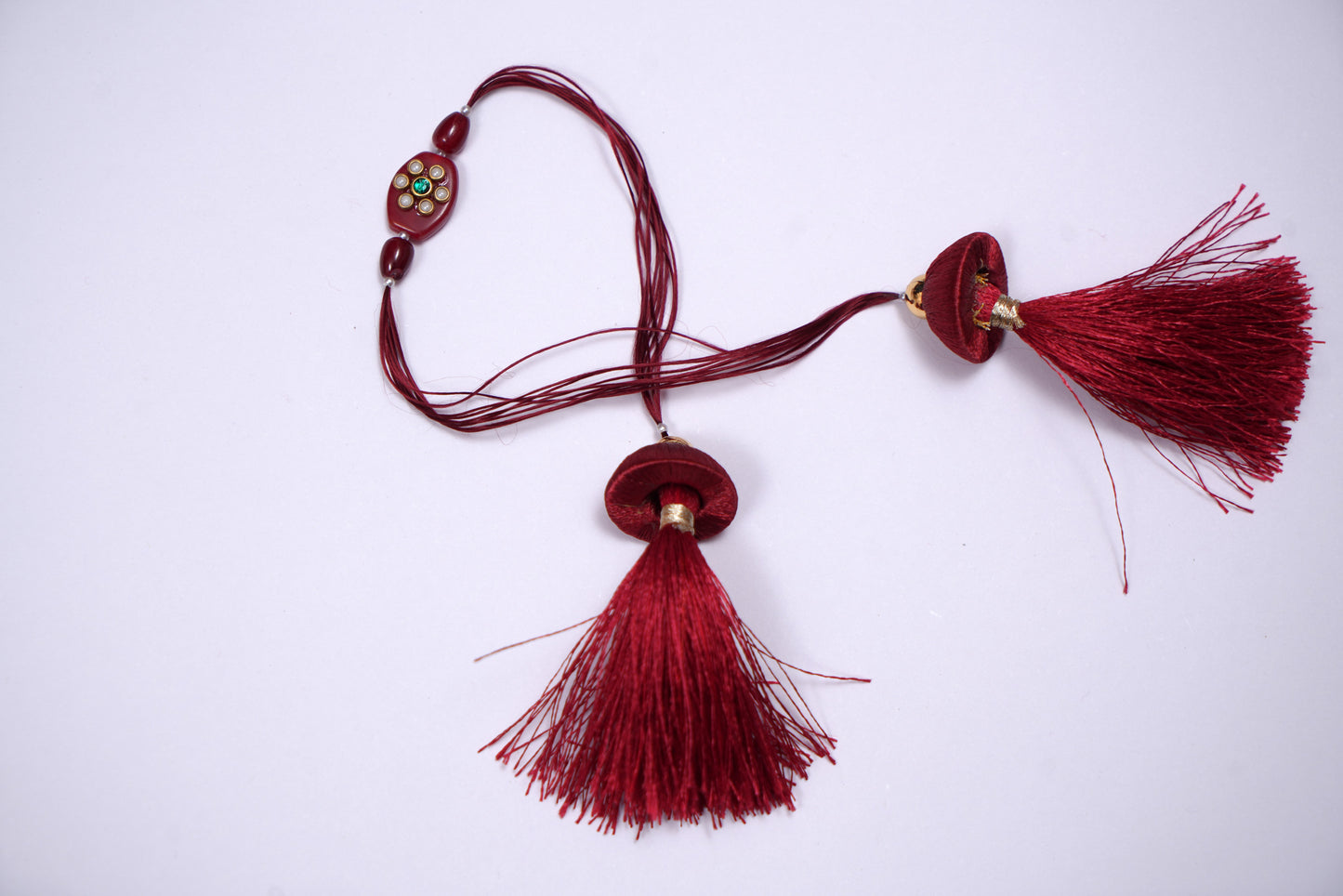 Tassel Kundan Studded Maroon Stone Rakhi