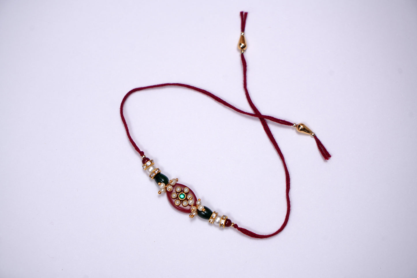 Pearl Studded Maroon Stone Rakhi