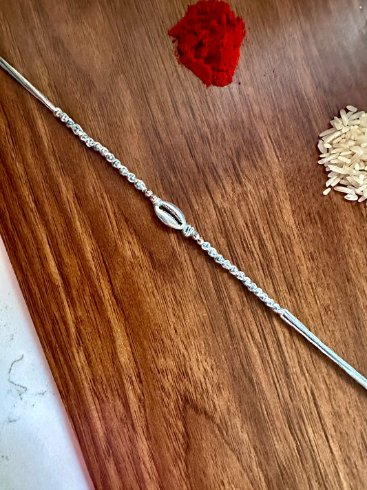 Silver shell Knot Rakhi