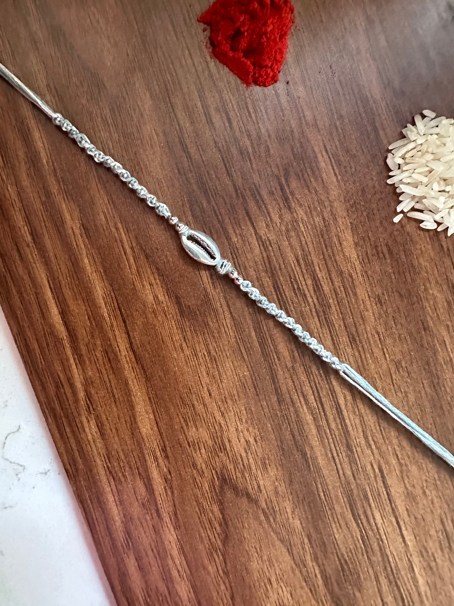 Silver shell Knot Rakhi