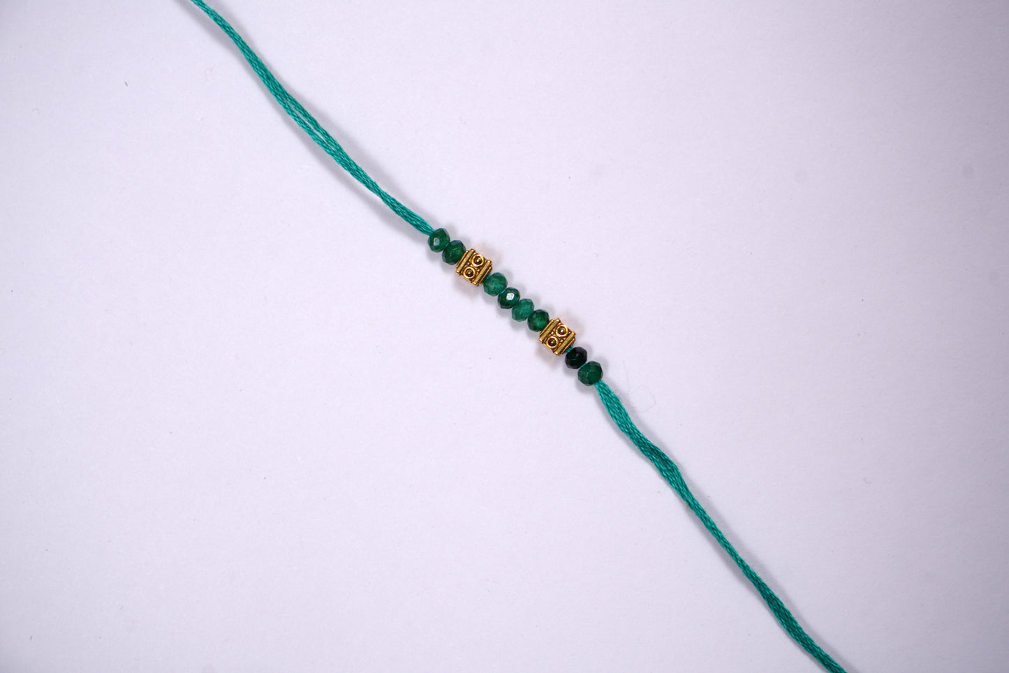 Emerald Golden Charm Rakhi