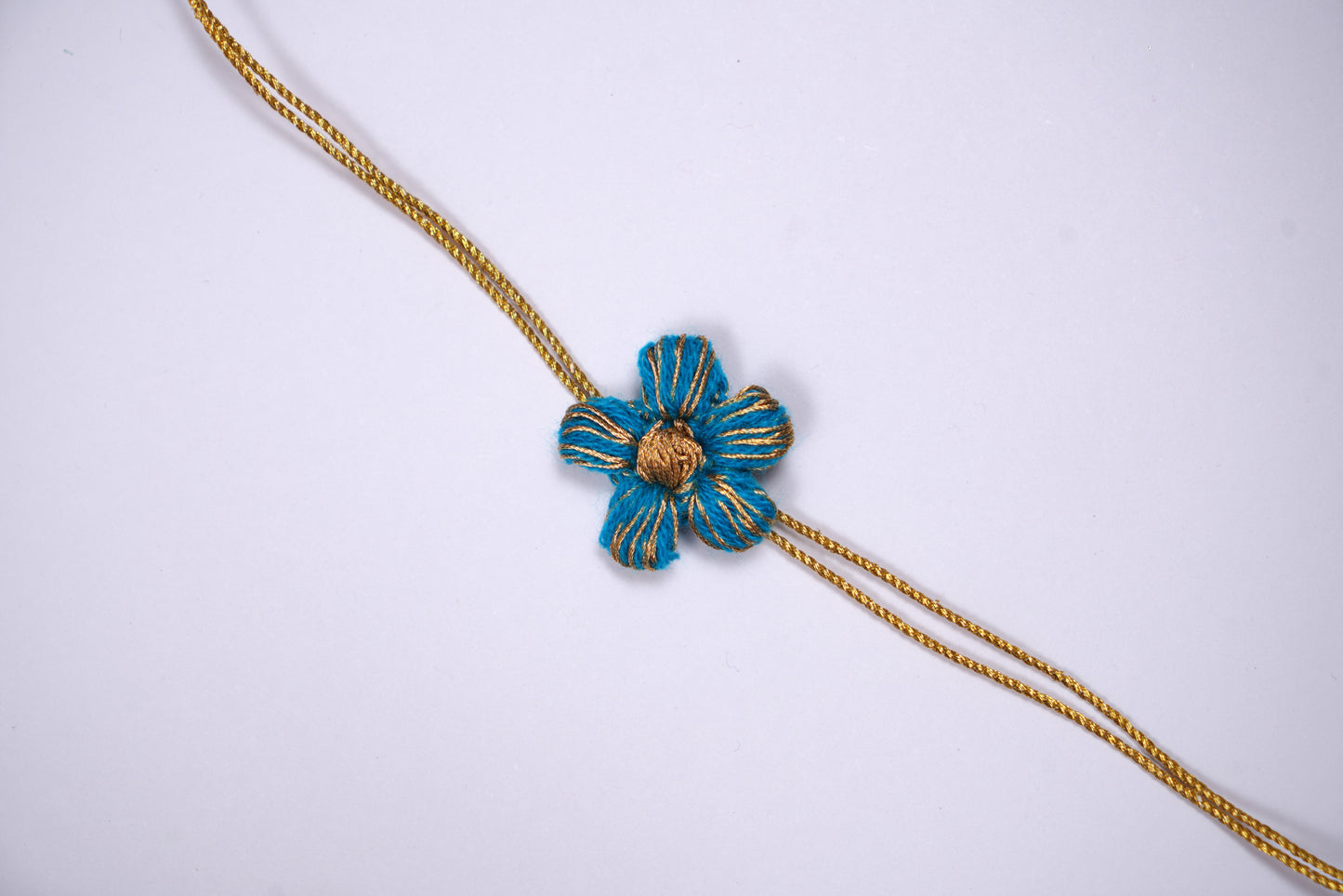 Blue Crochet Rakhi with Golden Blue Thread