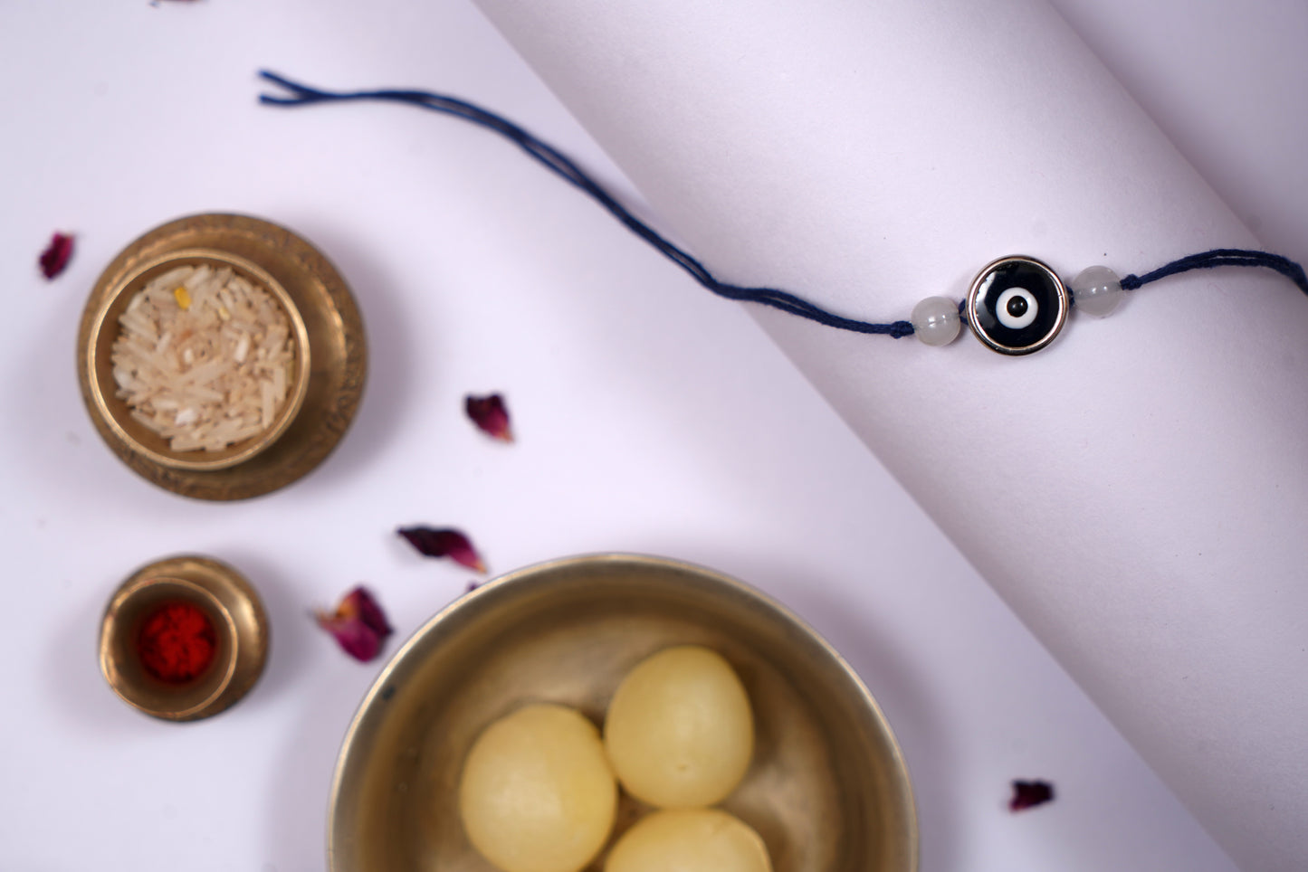 Blue Evil Eye Charm Rakhi on Blue Thread