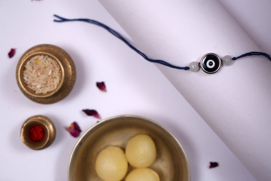 Blue Evil Eye Charm Rakhi on Blue Thread