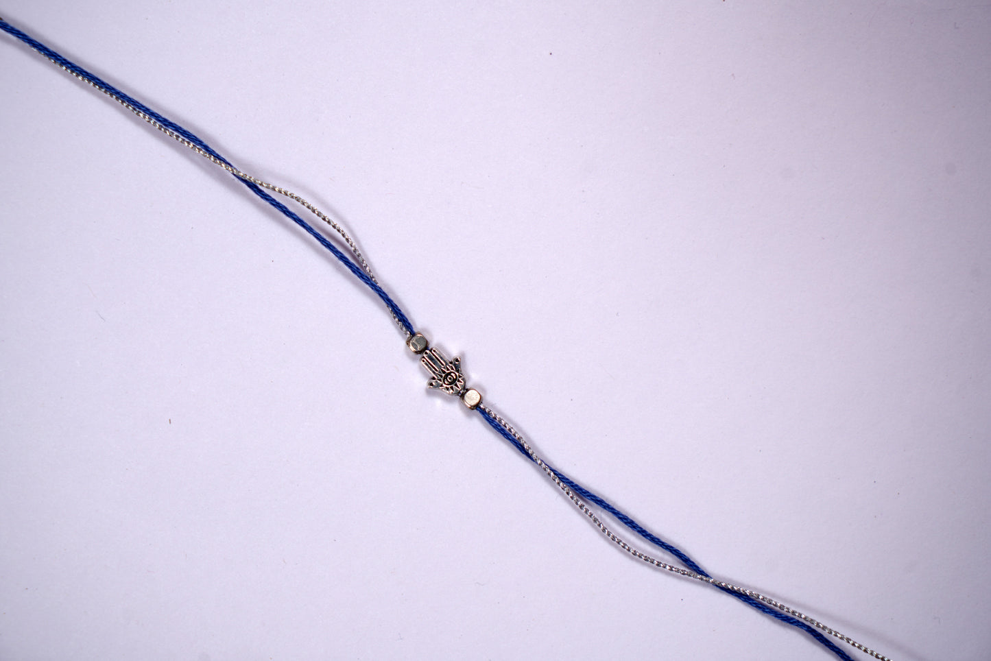 Evil Eye Rakhi with Silver Blue Thread