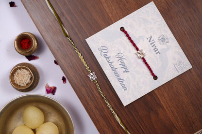 Braided Green Rakhi with Silver Lord Ganesha Charm