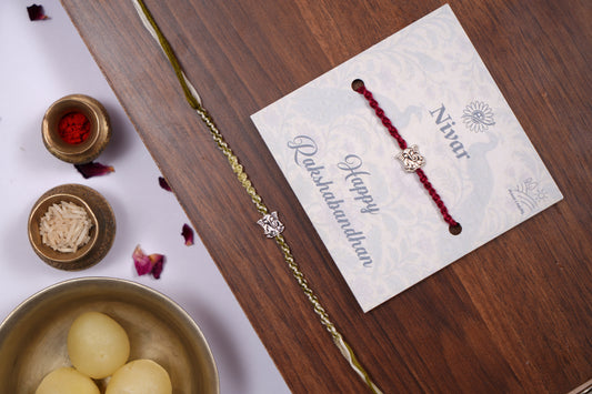 Braided Green Rakhi with Silver Lord Ganesha Charm