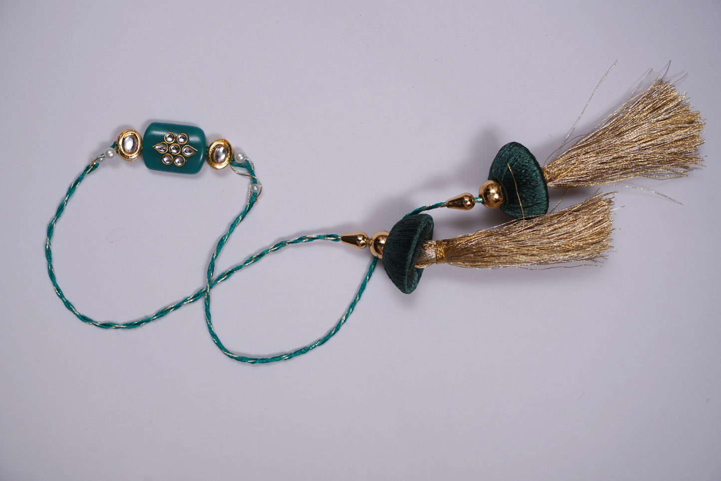 Tassel Kundan Studded Green Stone Rakhi