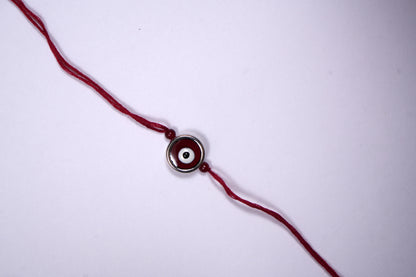 Maroon Evil Eye Charm Rakhi on Maroon Thread