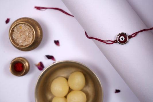 Maroon Evil Eye Charm Rakhi on Maroon Thread