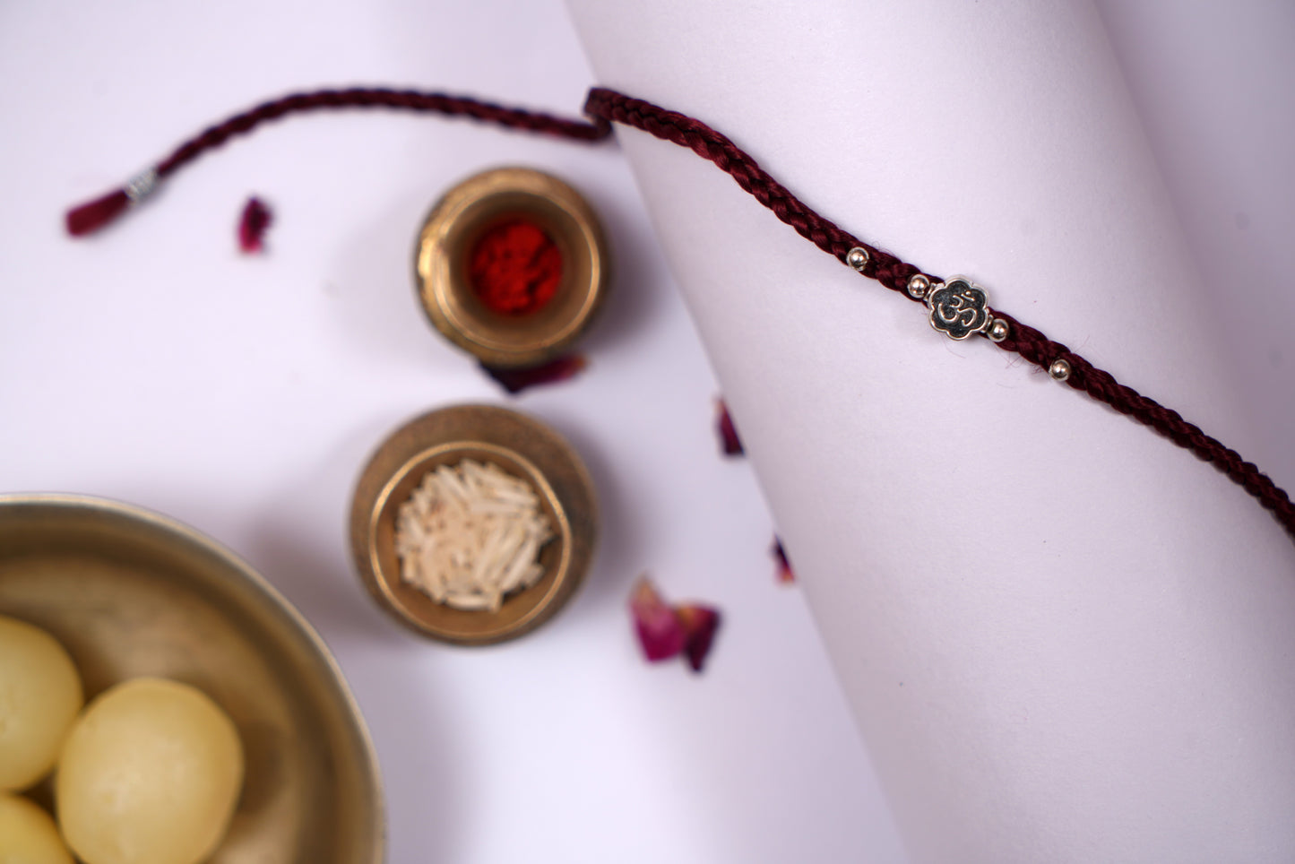 Maroon Braided Silk Thread Rakhi with Silver Om Charm