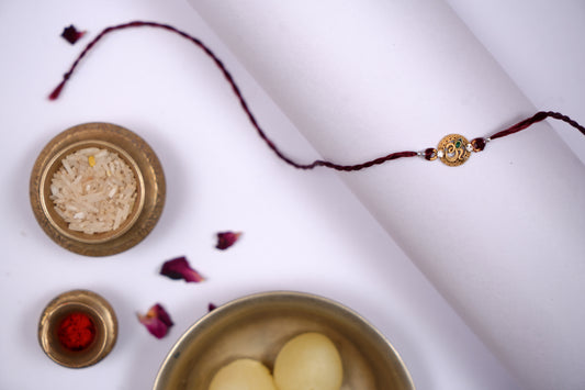 Maroon twisted Silk Thread Rakhi with Om Charm
