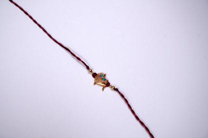 Maroon twisted Silk Thread Rakhi with Mor Pankh Charm