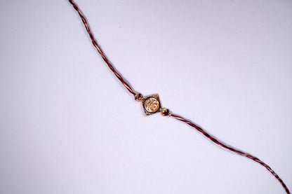 Golden Maroon twisted Silk Thread Rakhi with Ek Onkar Charm