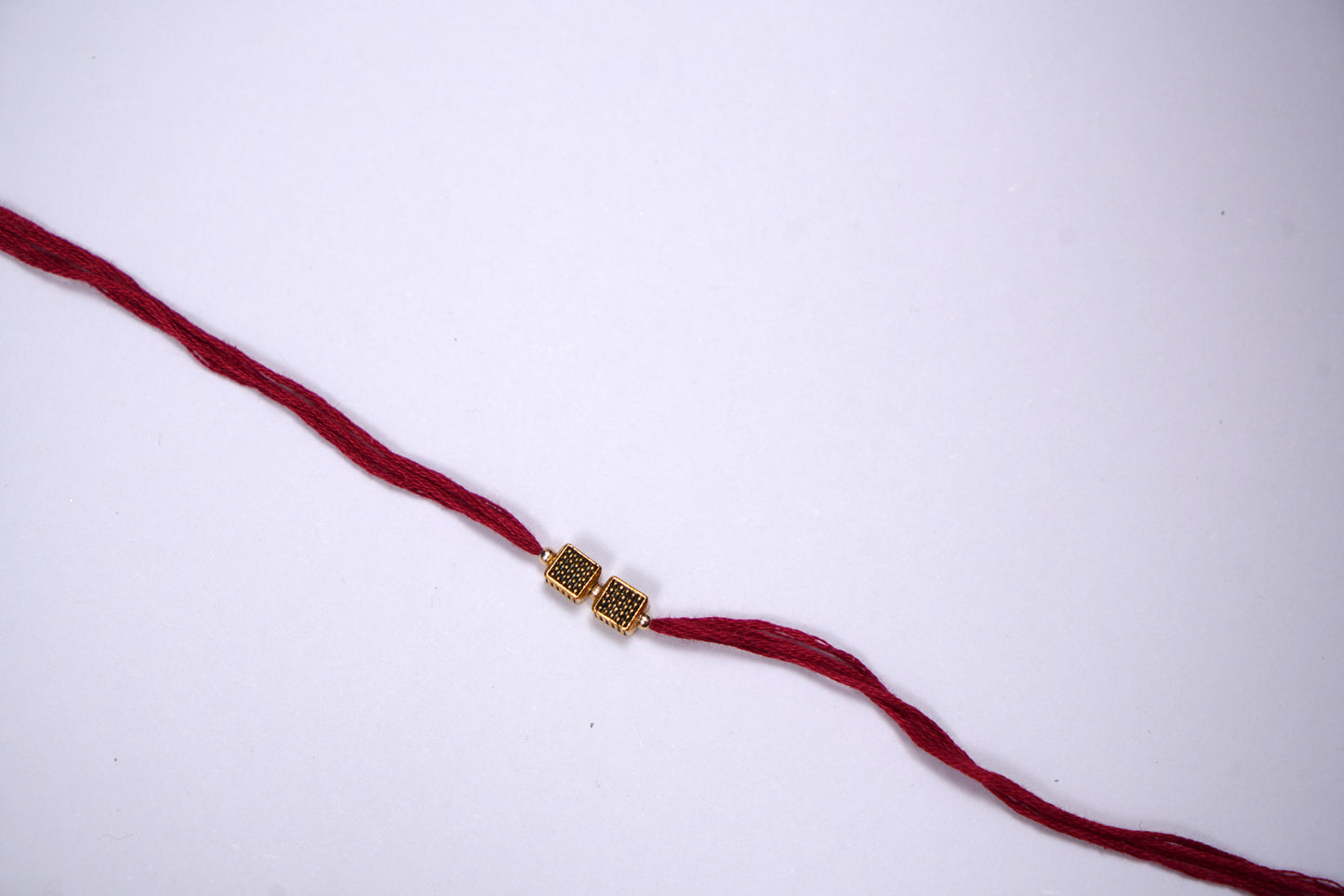 Elegant Golden Charm Rakhi