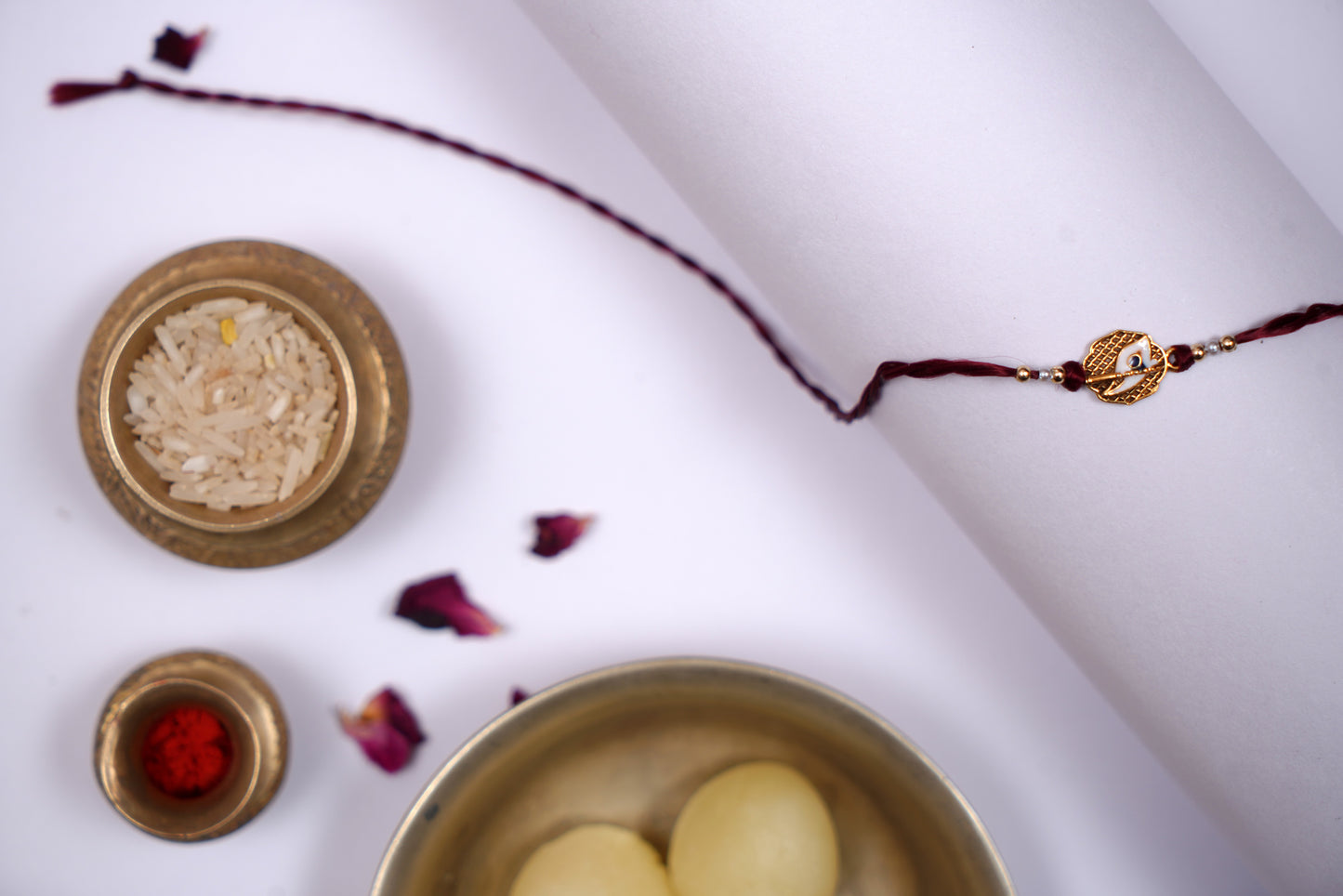 Maroon twisted Silk Thread Rakhi with White Mor Pankh Charm