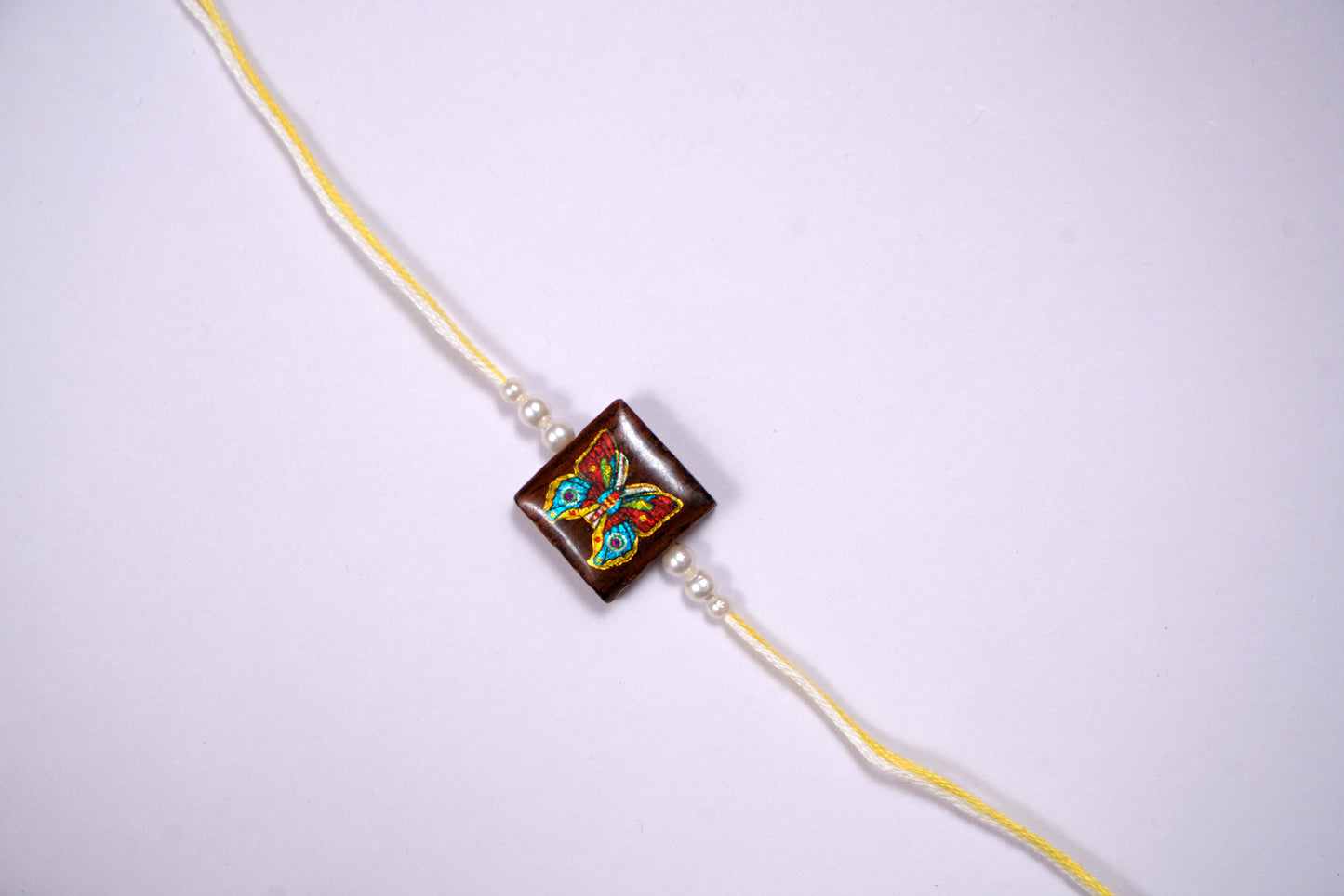 Multicolour Yellow Wooden Butterfly Rakhi